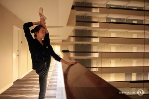 Evening stretching at the hotel, as Bella Fan is doing here, is a core part of a dancer’s life on the road. Be sure to say hi if you happen to see us at your hotel! (Photo by Helen Li)